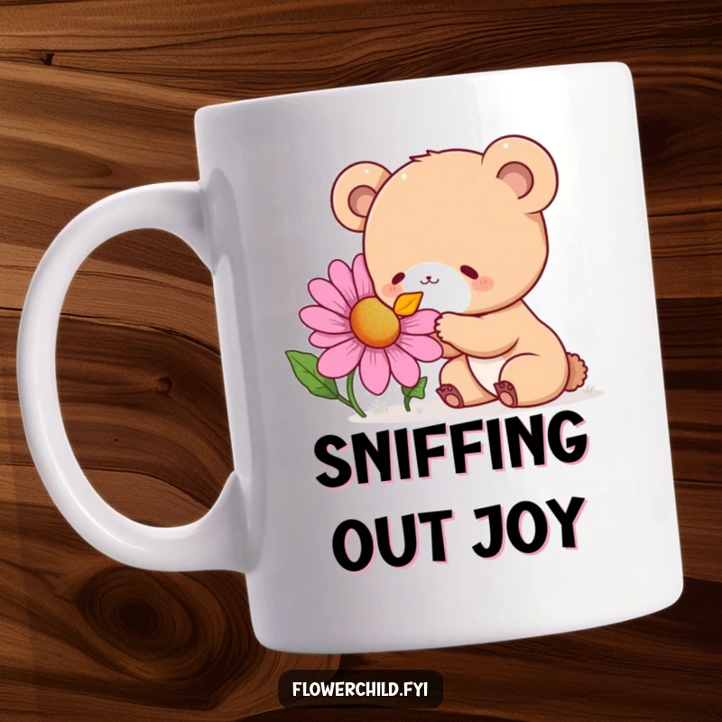 Funny Mug featuring a curious bear cub with wide eyes, delightedly sniffing a giant, colorful wildflower.