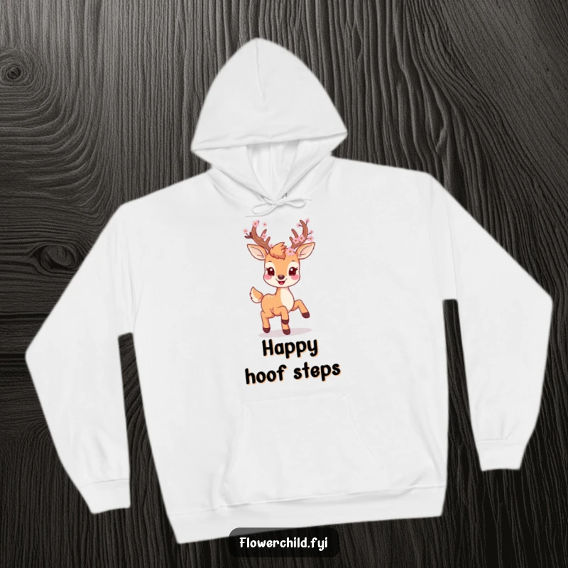 Cozy hoodie featuring a smiling deer with blossoms on its antlers, prancing playfully through a whimsical forest.